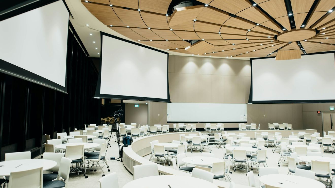 A conference room under flat house lighting before any event lighting is added